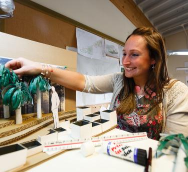 Student with garden design model